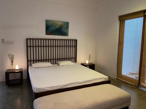 Ένα ή περισσότερα κρεβάτια σε δωμάτιο στο Kohomba House Colombo