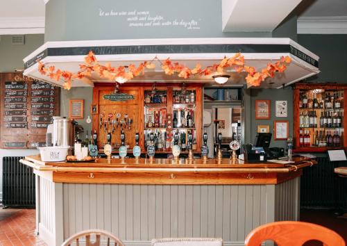 a bar with orange bows on the top of it at Station Hotel in Hucknall