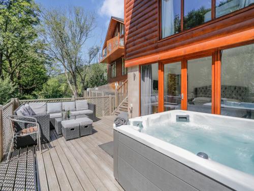 a hot tub on the deck of a house at Waterside Lodge Four - Uk36706 in Southowram