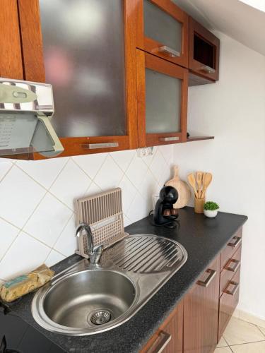 a kitchen counter with a sink in a kitchen at Murdeira V159D Duplex by RPG Group in Beirona