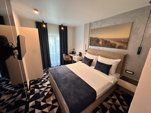 a bedroom with a large bed in a room at Hotel Modriča in Modriča