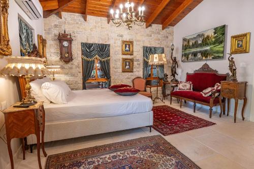 a bedroom with a bed and a table and chairs at אחוזת בר in Sha'al