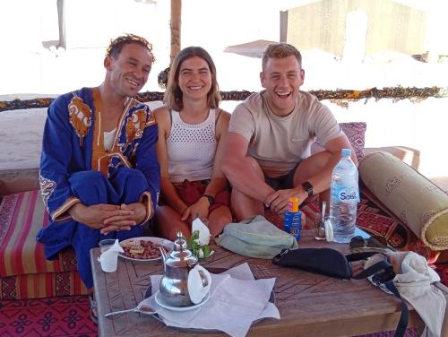 a group of three people sitting around a table at Dar Bani in Zagora