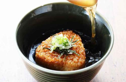 a sauce being poured into a bowl of food at Hotel LaLa (Adult Only) in Sakai