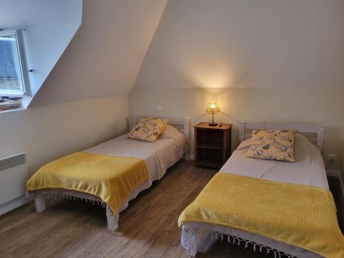 Ένα ή περισσότερα κρεβάτια σε δωμάτιο στο Gîte La maison de Galut