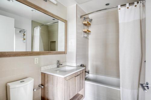 a bathroom with a sink and a shower at LIC 1BR w Gym DM Elevator Private Balcony NYC-768 in Long Island City