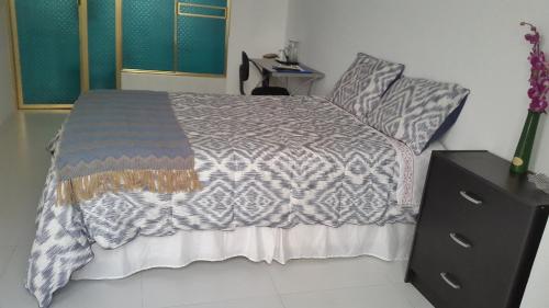 Ένα ή περισσότερα κρεβάτια σε δωμάτιο στο Magicperu Apart Hotel