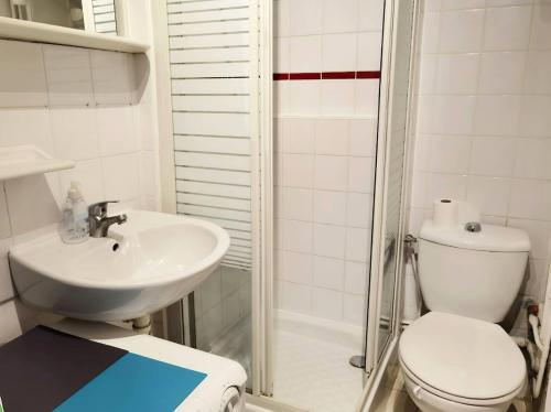a bathroom with a toilet and a sink and a shower at Cute Marais Studio near Metro Heart of Paris N4-22 in Paris