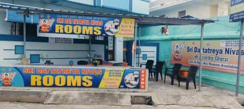 a restaurant with signs on the side of a building at Sri Dattatreya Nivas in Pithāpuram