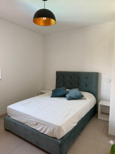 En eller flere senge i et værelse på Quinta de Louriz