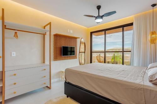 Giường trong phòng chung tại GB128 Excelente Vilage 4/4 em Guarajuba