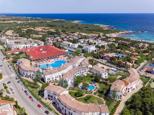 an aerial view of a resort near the ocean at Sol Falco Menorca in Son Xoriguer