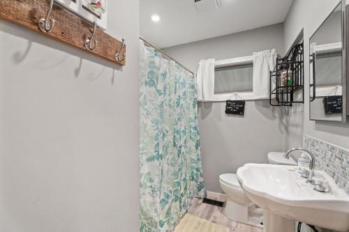 a bathroom with a sink and a toilet at Rustic Cabin Getaway Close to Everything Fun! in Beaver Dams
