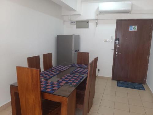a room with a table with a chess board on it at SkyLine 19 Apartment in Colombo