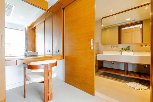 a bathroom with a sink and a mirror at Cape Sienna Villa 4-Oceanfront 5-Bedroom Luxury Villa with 22 m Infinity Pool in Kamala Beach