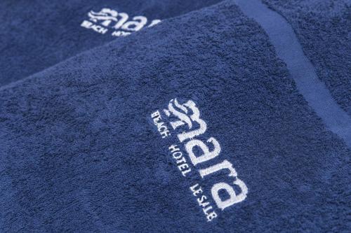 a blue sweater with white writing on it at Hotel Mara in Ortona