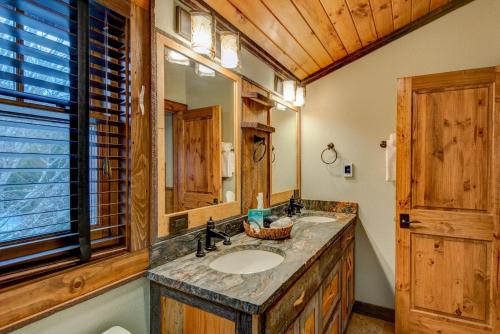 a bathroom with a sink and a mirror at Rivers Edge at Eagles Nest in Banner Elk