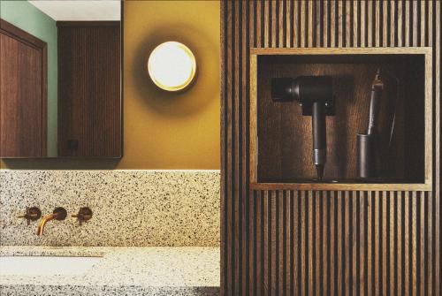 a bathroom with a sink and a mirror at Mollie's Manchester in Manchester