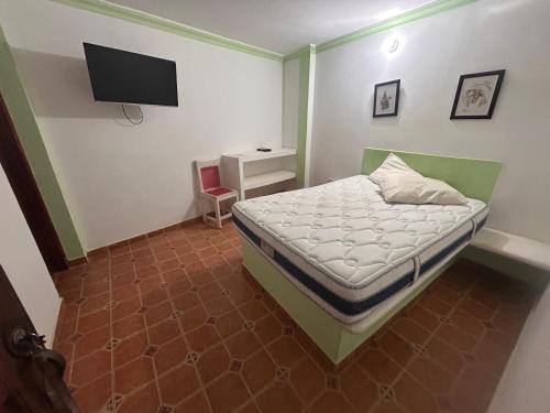 Postel nebo postele na pokoji v ubytování Hostal Mafelo Taganga
