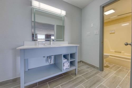 a bathroom with a sink and a mirror at Americas Best Value Inn Stearns, KY in Stearns