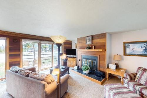 a living room with two couches and a fireplace at Timber Ridge 203 in Silverthorne