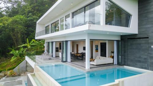 an image of a house with a swimming pool at Yamu Hills Panoramic Ocean View 6 Bed Luxury Vila in Phuket Town