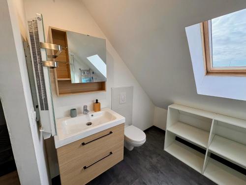 a bathroom with a sink and a toilet at Charmant Duplex 4 pers Au centre Douai Netflix in Douai