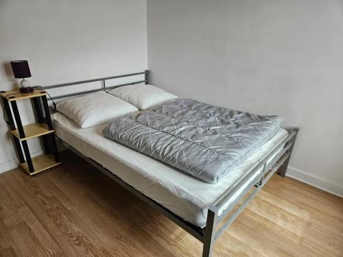 a bed in a room with at Maison charmante avec vue sur la montagne à Saint-Anthème in Faye-Furet