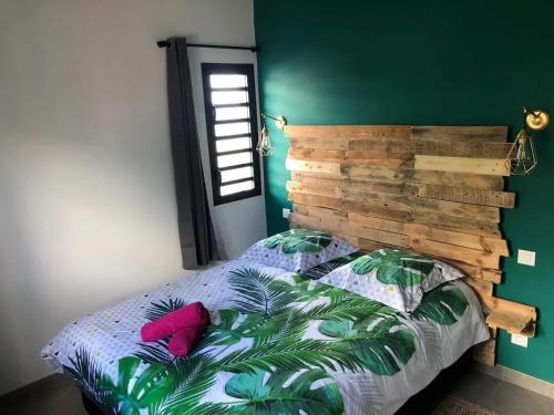 Voodi või voodid majutusasutuse Villa charmante avec piscine à Piton Saint-Leu, 120 m² toas