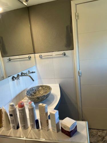 a bathroom with a sink and a bowl at Cabaña Macar in Caviahue