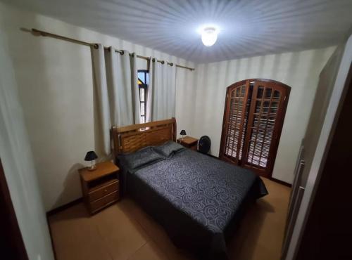 Ένα ή περισσότερα κρεβάτια σε δωμάτιο στο Sítio dos Lagos