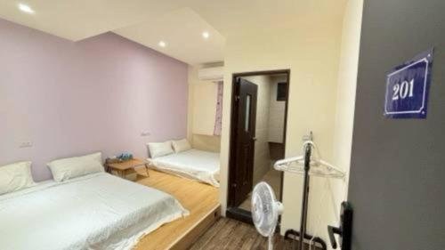 Postel nebo postele na pokoji v ubytování San Lin B&B