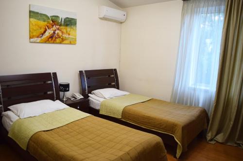 Ένα ή περισσότερα κρεβάτια σε δωμάτιο στο Hotel Grig