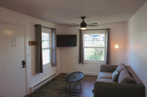 a living room with a couch and a window at The Spinn in Manzanita