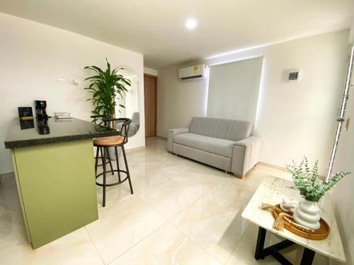 a living room with a couch and a table at Apartamento Sabaii 201 in Cartagena de Indias