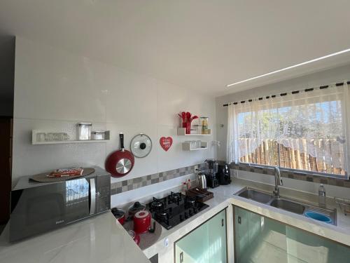 Galeriebild der Unterkunft Casa com ar condicionado, churrasqueira e rooftop in Alto Paraíso de Goiás