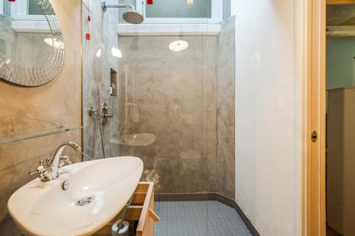 a bathroom with a sink and a shower at Romeos Cottage Public free parking bike rental in Verona