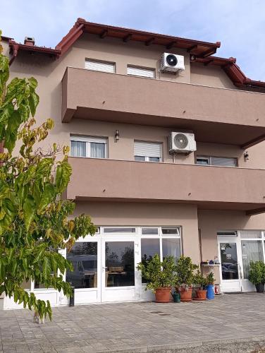 a building with speakers on the side of it at Luxury suites Marušić sobe 