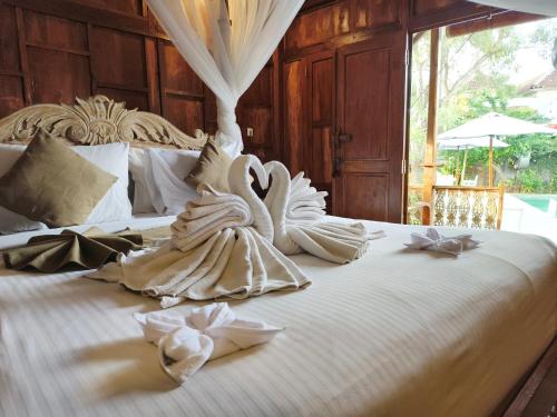 Postel nebo postele na pokoji v ubytování My Dream Bali Resort & Spa