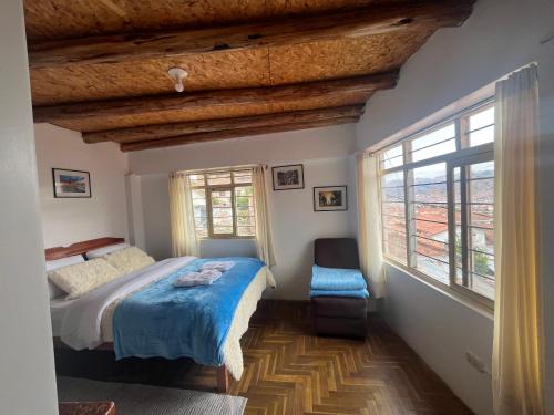 a bedroom with a bed and a window at Sky Garden in Cusco