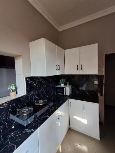 Photo de la galerie de l'établissement Karibu Jua Backpackers Hostel, à Mbeya