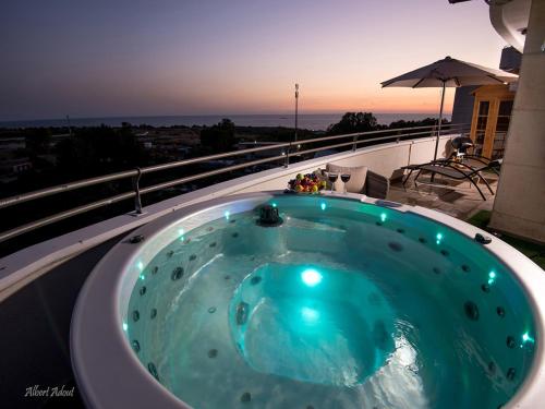a jacuzzi tub on the roof of a house at Siesta in Achziv in Nahariyya
