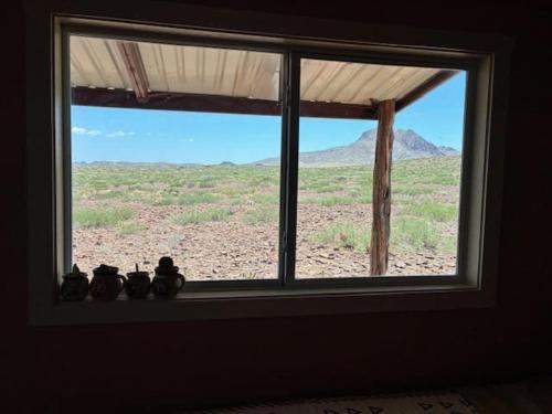 a window with a view of a desert view at Cabin at the Hill, Close to Big Bend National Park and Terlingua Ghost Town in Terlingua