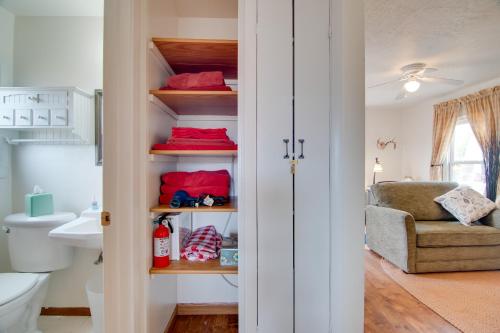 a room with a bathroom with a toilet and a chair at Red Gates Cottage 3 Miles to University! in Laramie