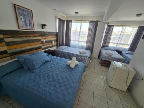 Postel nebo postele na pokoji v ubytování Hotel Andalucía
