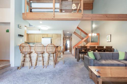 a living room with a couch and a table at Snowcreek IV 588 in Mammoth Lakes
