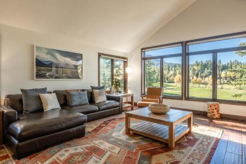 a living room with a couch and a table at Snowcreek V 731 in Mammoth Lakes