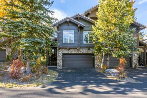 a house with a garage on a driveway at Snowcreek V 731 in Mammoth Lakes