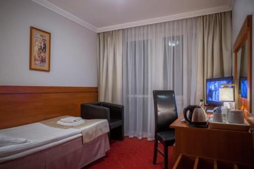 Postel nebo postele na pokoji v ubytování Hotel Cristal Park