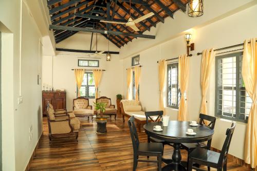 Posezení v ubytování The Paro Homestay Ashtamudi